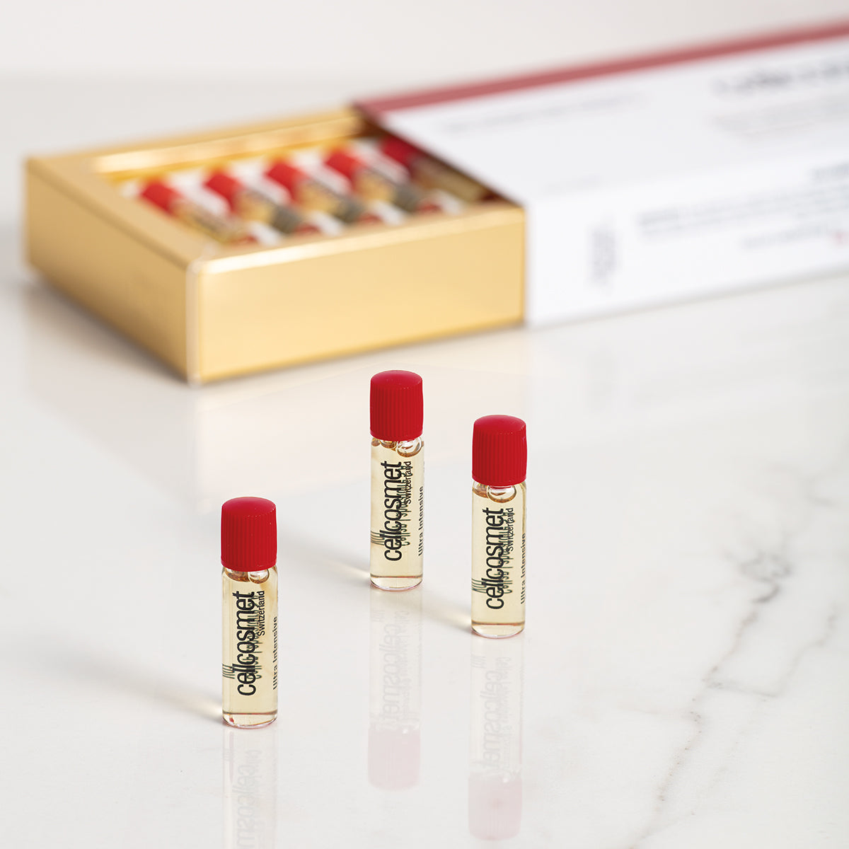 Cellcosmet Ultra Intensive Elasto-Collagen-XT with open box in background with 3 vials displayed.